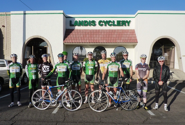 A group of cyclists posing for a photo.