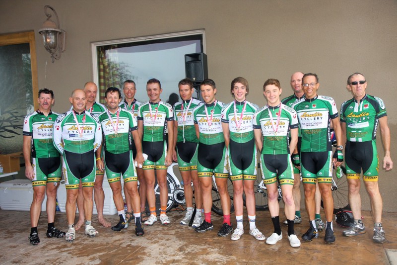A group of cyclists posing for a photo.