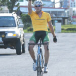 A man riding a bicycle.