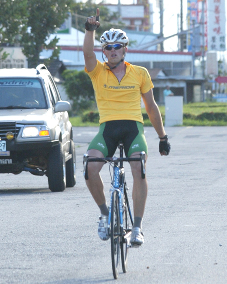 A man riding a bicycle.