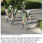 A group of people riding bicycles.