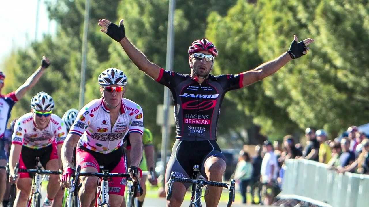 A group of cyclists are celebrating after winning a race.